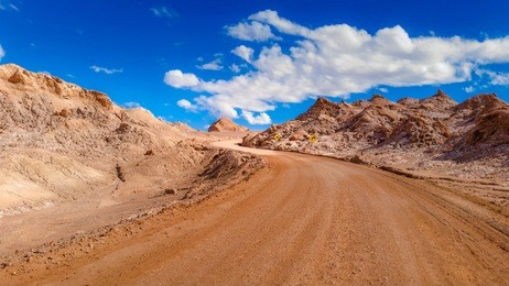 extreme landscape, dirt road in the moon valley, at san pedro de atacama, chile