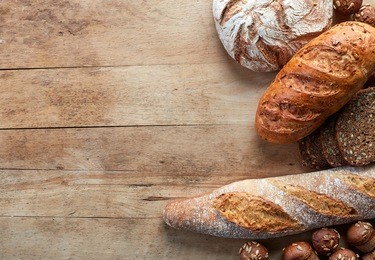 gluten free bread on wooden background from top view