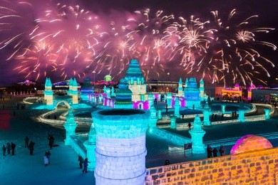 spectacular fireworks over ice and snow sculptures in harbin, china