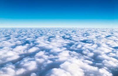 blue sky and cloud top view from airplane window,nature background.