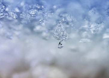 background from transparent icicles and sparkly snowflakes