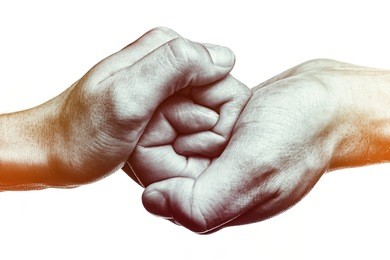 male and female hand  united  in  handshake. that could mean help, guardianship, protection, love, care etc. this image isolated for easy  transfer in your design.