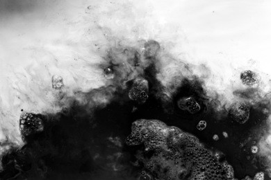 abstract background of  black ink dissolving in water