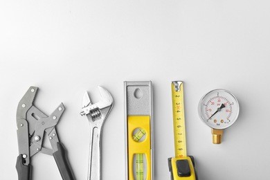 plumber equipment on light background