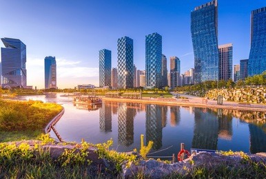 seoul city with beautiful after sunset, central park in songdo international business district, incheon south korea.