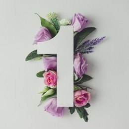 creative layout with colorful flowers, leaves and number one. anniversary concept.flat lay.