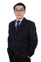 smiling asian chinese man wearing suit posing with confident in isolated white background.