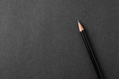 top view closeup pencil on black craft paper texture.