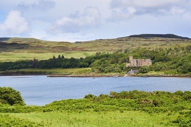 dunvegan loch and castle on the isle of skye, scotland, uk.      
