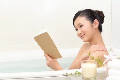 young beautiful woman taking relaxing bath