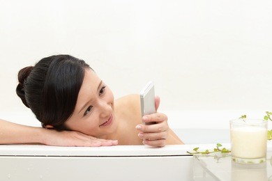 young beautiful woman taking relaxing bath