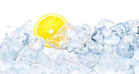 juicy lemon in ice cubes background.