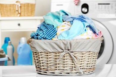 clothes in wicker basket at laundry