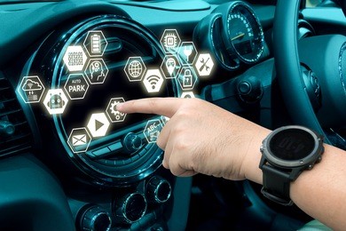 smart car and internet of things (iot) concept. finger point to car 's console and icons popup out of screen.