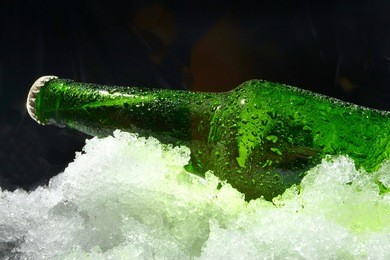 close up view of the bottle in ice