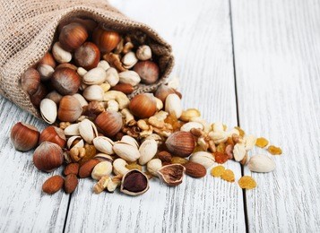 different types of nuts on a old wooden table