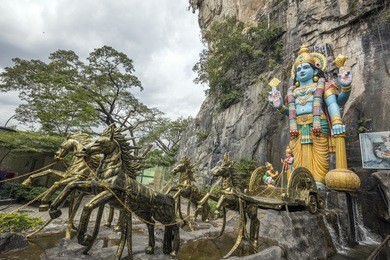 batu caves statue and entrance near kuala lumpur, malaysia