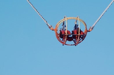 theme park catapult slingshot cage closeup with clear blue sky