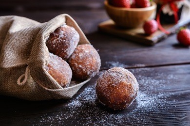 bomboloni - traditional italian doughnuts stuffed with strawberry jam