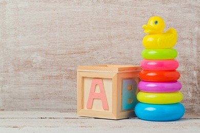 baby toys on wooden table. child development concept
