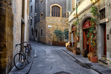 narrow street in florence, tuscany, italy. architecture and landmark of florence. cozy florence cityscape
