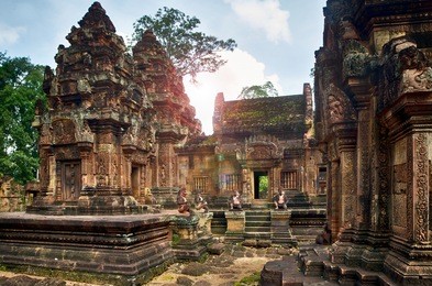 karuda bird gardians carvings at banteay srei red sandstone temple, cambodia