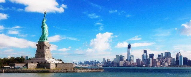 panorama on the statue of liberty and the skyline of manhattan, new york city, united states