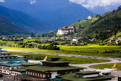 paro rinpung dzong with paro international airport in the foreground