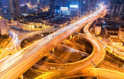 city overpass at night, circular flyover and traffic light intersection in shanghai