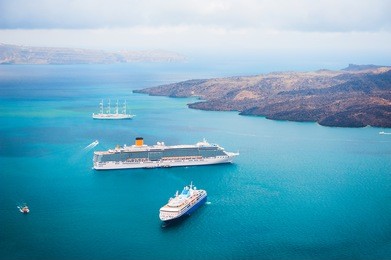 cruise ship at the sea near the greek islands. santorini island, greece