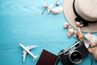summer holiday background, travel concept with camera on wooden table background