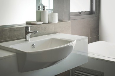 bathroom interior with sink and faucet.