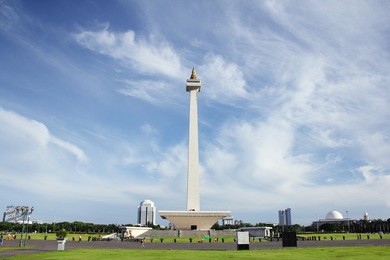 landscape front view shot of taman monas (national monument park) in jakarta, indonesia