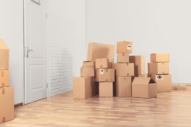 house move concept. carton boxes on floor in room