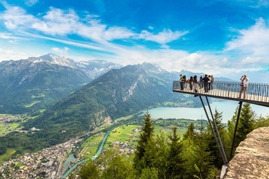 people standing on the observation deck in interlaken in a beautiful summer day, switzerland