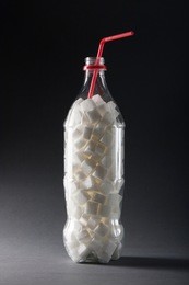 unhealthy food concept - sugar in carbonated drinks. high amount of sugar in beverages