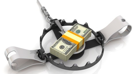 money as a dangerous lure. stack of packs of 100 dollar american bills, tied with a ribbon, as bait in trap on a white surface. isolated. 3d illustration