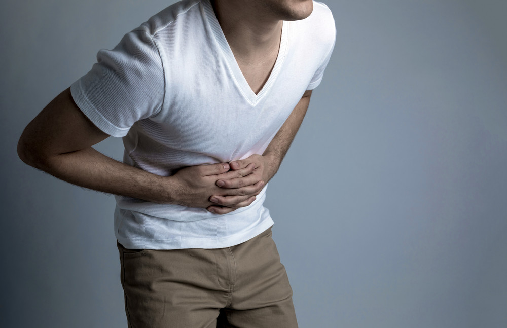 young man having a stomachache