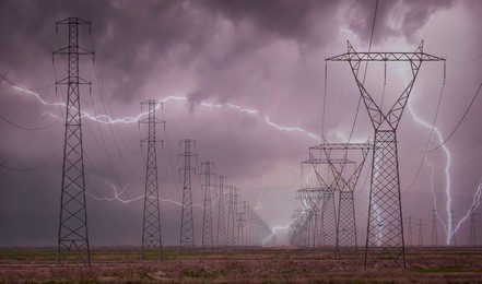 high voltage power lines with lightning