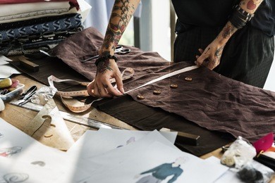 fashion designer cutting tailor made concept