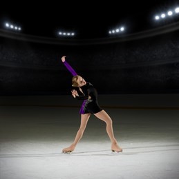 young girl figure skater (on ice arena with spotlights ver)
