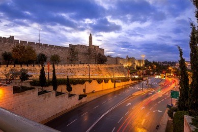 road going past the tower of david and the old city walls of jerusalem