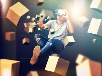 visual reality concept.young asian man using visual reality or vr headset  and interacting with object.man getting experience using vr-headset glasses.