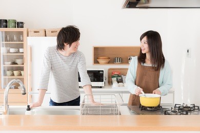 young asian couple cooking in the kitchen