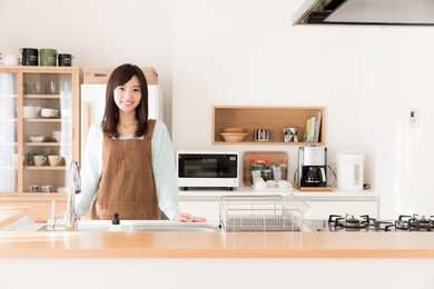 portrait of young asian woman in the kitchen