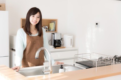 portrait of young asian woman in the kitchen
