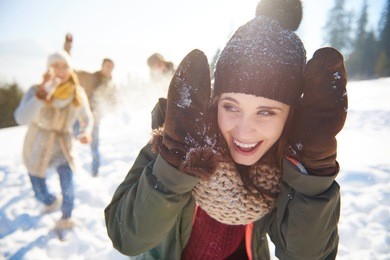 woman about to be hit with a snowball