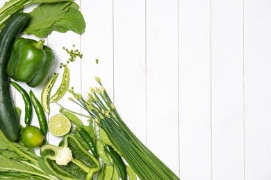 fresh green vegetables on a white background.