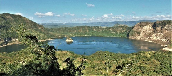 the crater of taal volcano in batangas, philippines is still full of sulfur, the volcanic gas.  to hike to the crater, you have to take one and a half hour boat ride and hike on foot for three hours. 