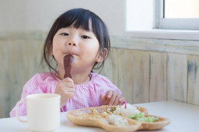 asian little girl having lunch